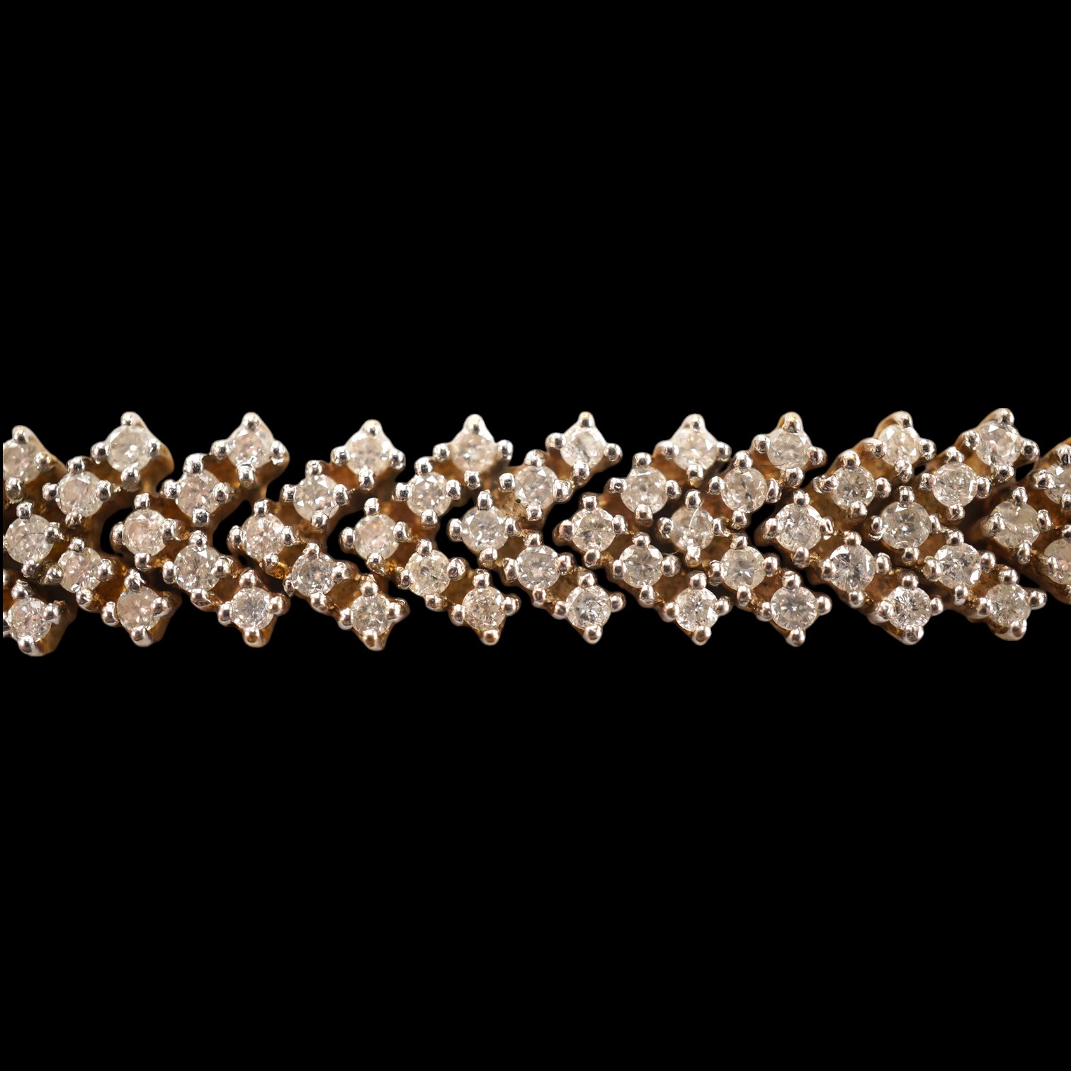 A modern 9ct gold and diamond cluster set bracelet, with arrow shaped links, 19.5cm, gross weight 25.2 grams. Condition - fair to good